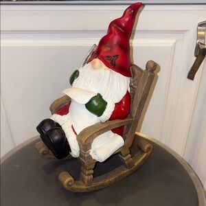 Festive Holiday Santa Gnome in Rocking Chair Checking His Naughty or Nice List